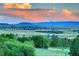 Stunning view of rolling hills and distant mountains from a home in a peaceful, upscale neighborhood at 770 International Isle Dr, Castle Rock, CO 80108