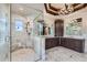 Elegant bathroom features dual sinks, marble countertops, soaking tub, and glass shower at 770 International Isle Dr, Castle Rock, CO 80108