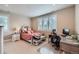 Bright bedroom with white trim, a patterned bedspread, and ample natural light from the window at 770 International Isle Dr, Castle Rock, CO 80108