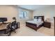 Comfortable bedroom with a desk, chair, and wooden bed frame complemented by natural light at 770 International Isle Dr, Castle Rock, CO 80108