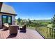 Enjoy the fresh air and beautiful vista from this home's outdoor deck, with seating for four at 770 International Isle Dr, Castle Rock, CO 80108