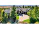 Beautiful home featuring lush landscaping, a paved driveway, and a tile roof in an upscale neighborhood at 770 International Isle Dr, Castle Rock, CO 80108