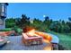 Outdoor stone fire pit area provides an ideal setting for evening relaxation and gatherings at 770 International Isle Dr, Castle Rock, CO 80108