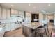 Spacious kitchen with granite countertops, a large island with seating, and professional-grade stainless steel appliances at 770 International Isle Dr, Castle Rock, CO 80108