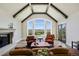 Living room featuring vaulted ceilings, a fireplace, and natural light with expansive outdoor views at 770 International Isle Dr, Castle Rock, CO 80108