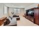 Recreation room features a gray sofa, media center and plantation shutters at 770 International Isle Dr, Castle Rock, CO 80108