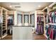Spacious walk-in closet featuring custom storage solutions and natural light at 770 International Isle Dr, Castle Rock, CO 80108