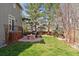 Well-maintained backyard with a fire pit, patio area, and manicured lawn at 4094 Bimini Ct, Boulder, CO 80301
