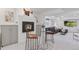 Inviting basement featuring a cozy fireplace, stylish bar seating, and open space for flexible living at 4094 Bimini Ct, Boulder, CO 80301