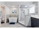 Sleek bathroom design with a standalone tub, glass-enclosed shower, and modern vanity for a luxurious experience at 4094 Bimini Ct, Boulder, CO 80301