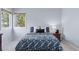 Bright bedroom featuring natural light and a comfortable bed with stylish bedding and neutral color palette at 4094 Bimini Ct, Boulder, CO 80301