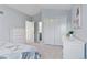 Bright bedroom showcasing modern white furniture, including a dresser and wardrobe, with an open doorway at 4094 Bimini Ct, Boulder, CO 80301