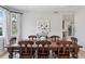 Elegant dining room with a large wooden table, comfortable chairs, and bright natural light at 4094 Bimini Ct, Boulder, CO 80301