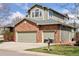 Charming two-story home featuring a brick facade and a spacious two-car garage at 4094 Bimini Ct, Boulder, CO 80301
