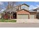 Beautiful two-story home with mature landscaping, a welcoming front porch, and two-car garage at 4094 Bimini Ct, Boulder, CO 80301