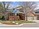 Inviting two-story home with a cozy front porch, mature trees, and a well-maintained lawn at 4094 Bimini Ct, Boulder, CO 80301