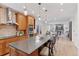 Modern kitchen with a large island, wood cabinets, stainless steel appliances, and an open floor plan at 4094 Bimini Ct, Boulder, CO 80301