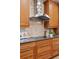 Close-up of a well-equipped kitchen with stainless steel appliances and custom wood cabinets at 4094 Bimini Ct, Boulder, CO 80301