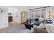 Cozy living room featuring neutral tones, a decorative cabinet, and an inviting atmosphere at 4094 Bimini Ct, Boulder, CO 80301