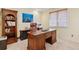 Executive office space with a large wooden desk, built-in bookcase, and a comfortable leather chair at 4094 Bimini Ct, Boulder, CO 80301