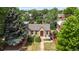 Lovely aerial view of charming brick home with manicured lawn and blue sky at 2435 N Irving St, Denver, CO 80211