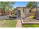A fenced-in backyard featuring a lawn, patio, and garden area at 2435 N Irving St, Denver, CO 80211
