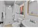 An updated bathroom with a standing shower and modern fixtures at 2435 N Irving St, Denver, CO 80211