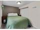Basement bedroom with dark accent wall, plush carpet, and a double closet at 2435 N Irving St, Denver, CO 80211
