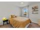 Bright bedroom with light walls, carpet, and a window letting in natural light at 2435 N Irving St, Denver, CO 80211