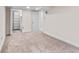 Empty bedroom featuring plush carpet, access to closet space, and a neutral color palette at 2435 N Irving St, Denver, CO 80211