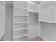Walk-in closet with adjustable shelving and hanging rods at 2435 N Irving St, Denver, CO 80211