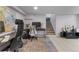 Basement office featuring tile floors, a colorful rug, and multiple work stations at 2435 N Irving St, Denver, CO 80211
