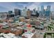 This aerial shot highlights the property surrounded by buildings, featuring its location near downtown Denver's skyline at 1435 Wazee St # 408, Denver, CO 80202