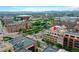 An aerial shot displays the property's location amidst a vibrant cityscape, near parks and commercial areas at 1435 Wazee St # 408, Denver, CO 80202