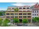 Loft building exterior featuring a brick facade and mature trees at 1435 Wazee St # 408, Denver, CO 80202