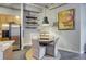 Cozy dining area with a round table, neutral-colored chairs, and unique decorative shelves for a stylish look at 1435 Wazee St # 408, Denver, CO 80202