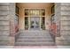 Building entrance with steps leading to glass doors and planters on each side at 1435 Wazee St # 408, Denver, CO 80202