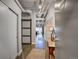 Entryway with hardwood floors, sliding barn door, coat closet, and hall table with decor at 1435 Wazee St # 408, Denver, CO 80202
