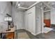 Apartment entryway with hardwood floors, coat closet and decorative hall table at 1435 Wazee St # 408, Denver, CO 80202