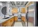 Modern kitchen features granite countertops, stainless steel appliances, and light wood cabinetry, showcasing style at 1435 Wazee St # 408, Denver, CO 80202