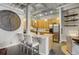 Kitchen featuring stainless steel appliances, light wood cabinetry, a granite-topped island, and industrial ceiling at 1435 Wazee St # 408, Denver, CO 80202