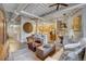 Open concept living space with an industrial-style ceiling, cozy seating, and a view of the modern kitchen at 1435 Wazee St # 408, Denver, CO 80202