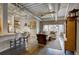 Inviting living space with exposed ductwork, modern furniture, and an open layout with kitchen area at 1435 Wazee St # 408, Denver, CO 80202