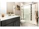 Bathroom with vanity, toilet and shower at 18722 W 87Th Ave, Arvada, CO 80007