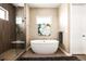 Modern bathroom with soaking tub and walk-in shower at 18722 W 87Th Ave, Arvada, CO 80007