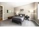 Cozy bedroom with gray bedding and modern decor at 18722 W 87Th Ave, Arvada, CO 80007