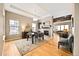 Elegant dining room featuring hardwood floors and natural light from large windows at 18722 W 87Th Ave, Arvada, CO 80007