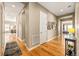 Bright hallway with hardwood floors and views into other rooms at 18722 W 87Th Ave, Arvada, CO 80007