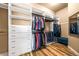 Large walk-in closet with ample shelving and hanging space at 18722 W 87Th Ave, Arvada, CO 80007