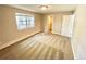 The bedroom features neutral walls and carpet, and a window with natural light at 64 Nome Way # C, Aurora, CO 80012